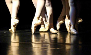 Close up of legs and feet in ballet slippers on pointe