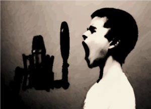 Young boy yells into microphone