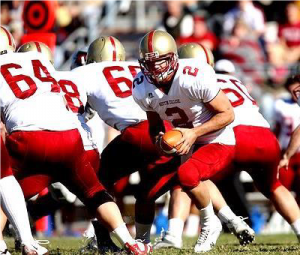 Group of football players of the field in the middle of a play
