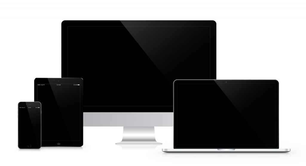 reflective black computer and tablet screens